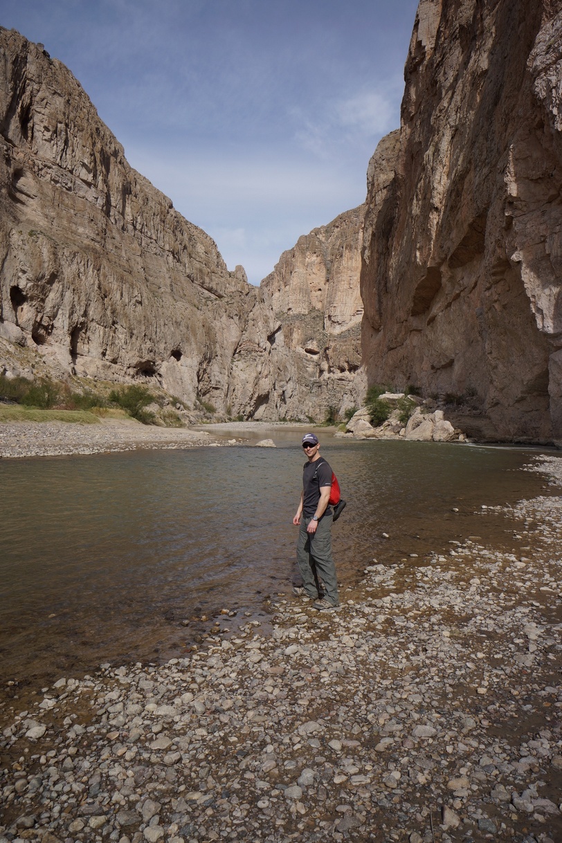 standing along the rio grande river in boquillas canyon, mexico