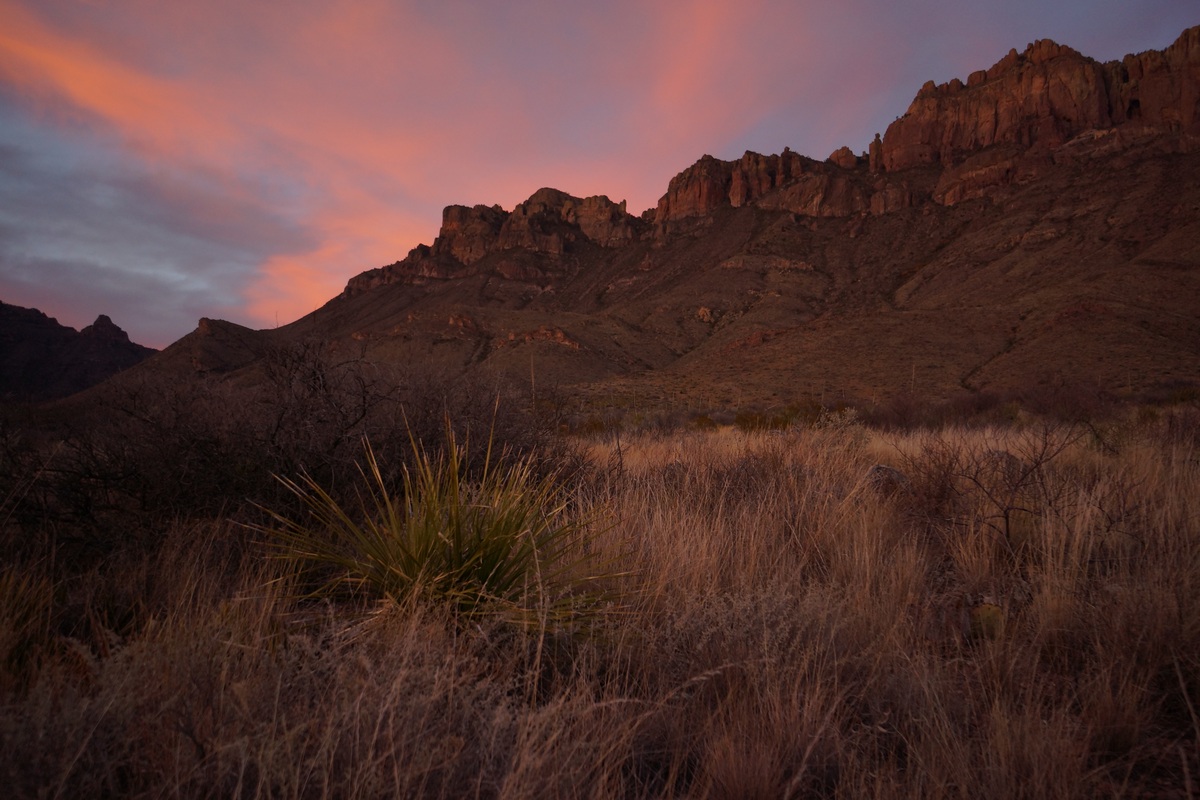 red sky behind crown mountain in big bend national park