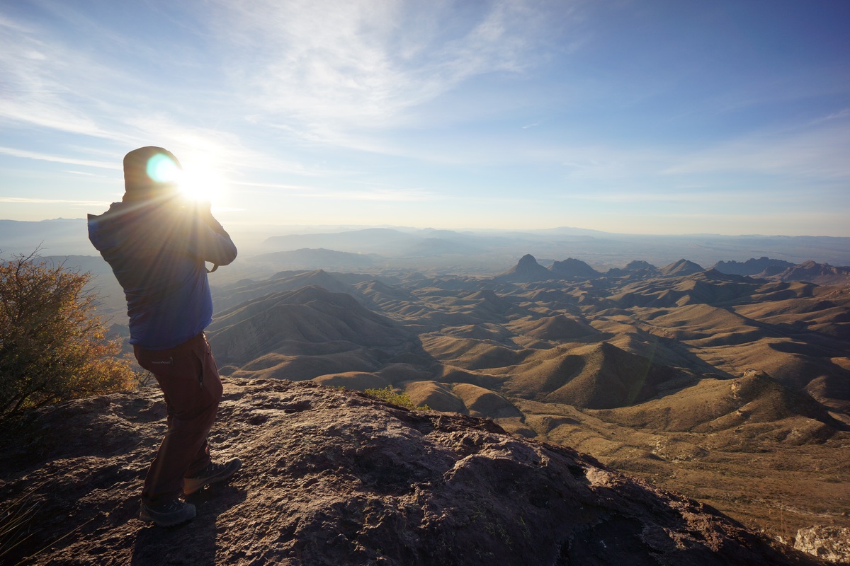 sunrise behind silhouette of person in big bend