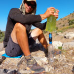 Thru Hiker Filtering Nasty Green Water With Sawyer Filter