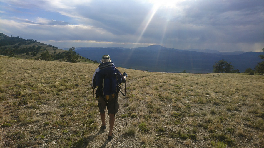 hiker walking the crest of the pequop range
