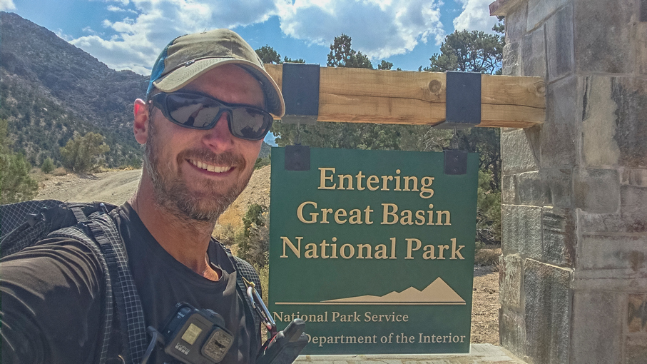 basin and range trail thru hiker at great basin national park sign