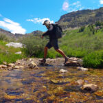 hiker crossing second boulder creek in the east humboldt range, Nevada