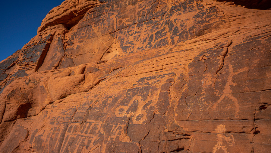 petroglyphs on red rocks in nevada