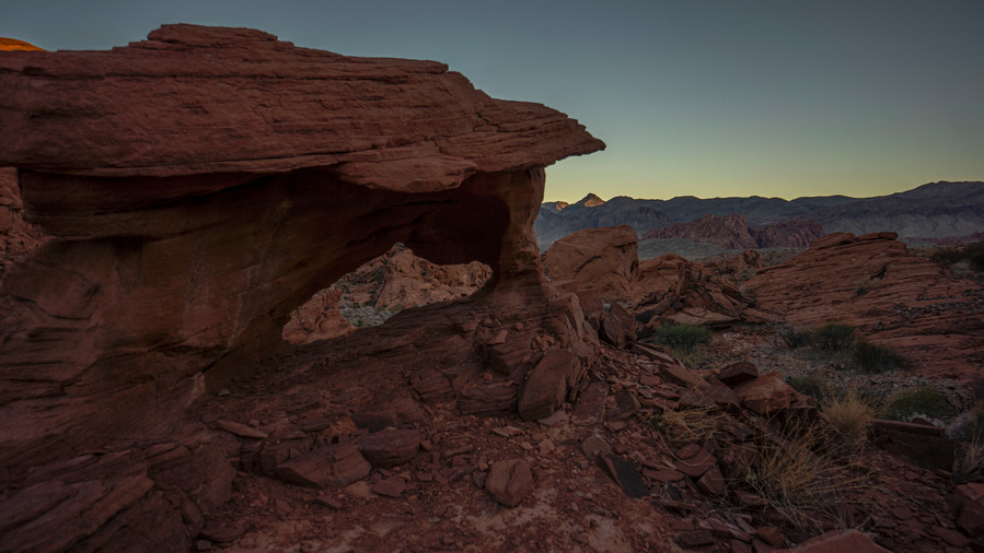 small arch in valley of fire at sunset