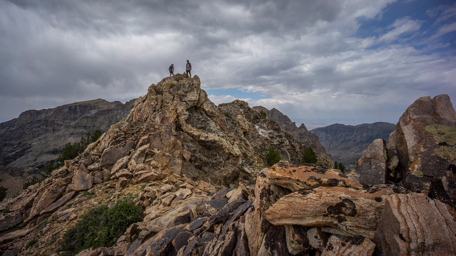 two hikers on the summit of no echo knob in ruby mountains nevada