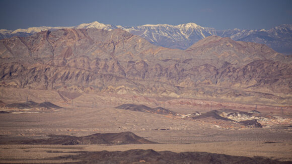 view of spring mountains and rainbow mountains wilderness with snow from lake mead