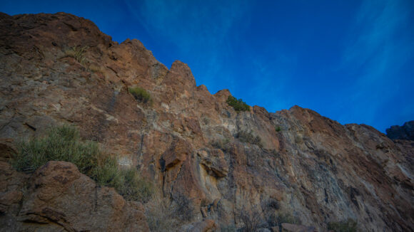 climbing a vertical rock wall in the mount nutt wilderness 